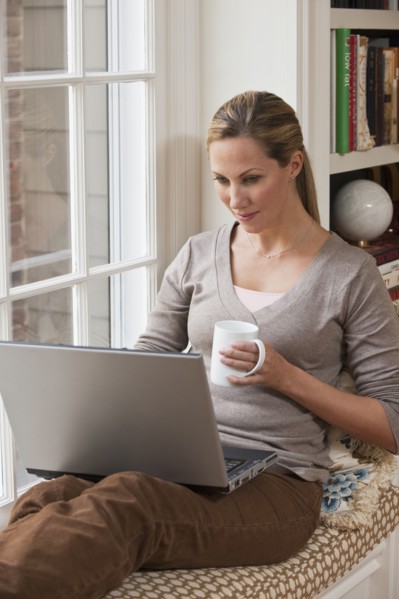Woman working on laptop.