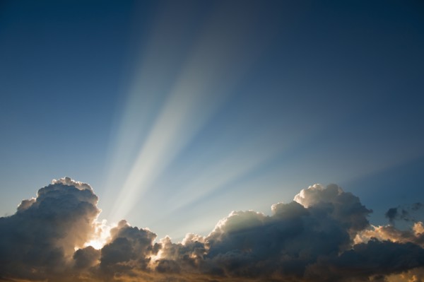 Sunset behind clouds.