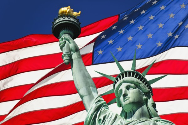 Statue of liberty and American flag.