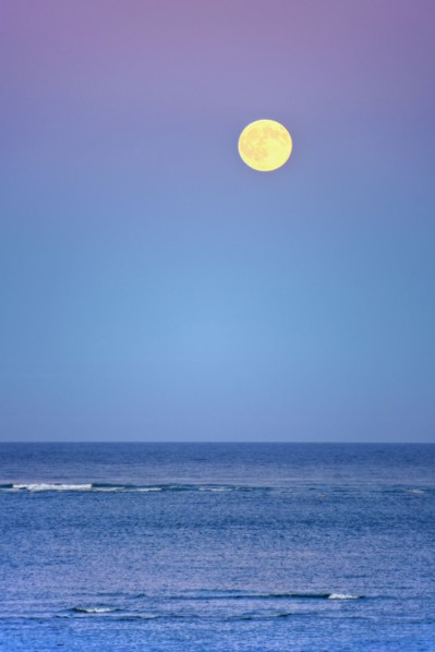 Moonrise over ocean.