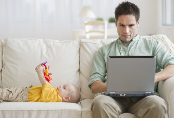 Father and son on couch.
