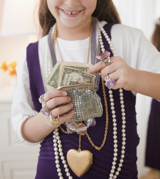 Young girl playing dress-up. Photographer: Jamie Grill