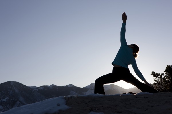 Woman doing yoga outdoors. Photographer: Dan Bannister