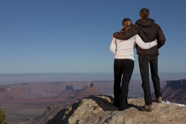 Couple looking at canyon. Photographer: Dan Bannister