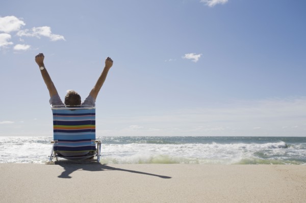 Relaxing on the beach. Photographer: Chris Hackett