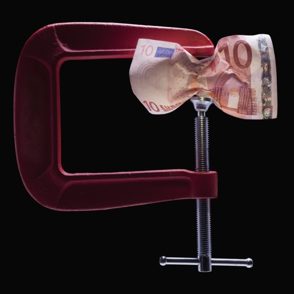 Money in a clamp. Photographer: Mike Kemp