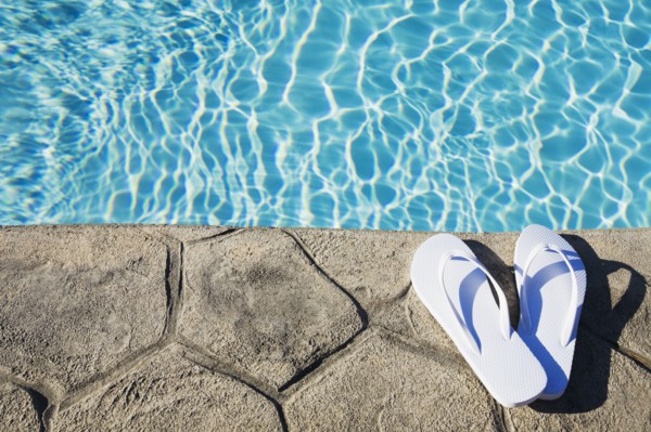 Flip flops by the pool. Photographer: Chris Hackett