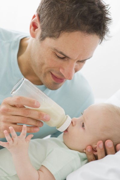 Father feeding baby.