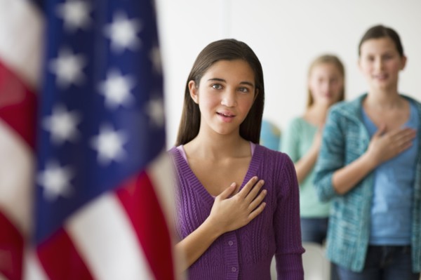Students saying pledge of allegiance.