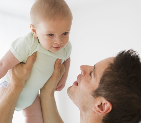 Father holding baby.