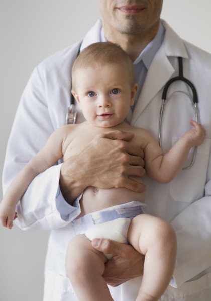 Doctor holding baby.