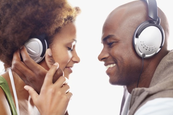 Couple wearing headphones. Photographer: momentimages