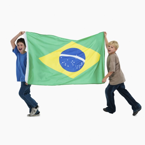 Two boys carrying flag. Photographer: momentimages