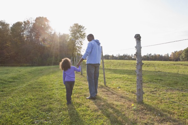Father and daughter walking. Photographer: Pauline St.Denis