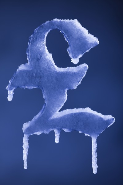Frozen British pound symbol. Photographer: Mike Kemp