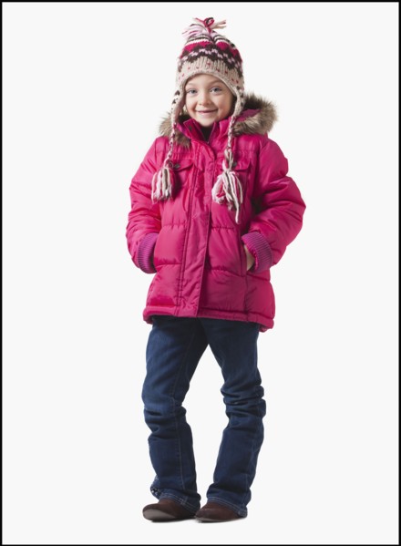 Young girl wearing winter clothing. Photographer: Mike Kemp