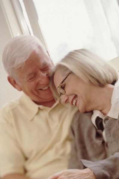 Elderly couple embracing. Photographer: Rob Lewine