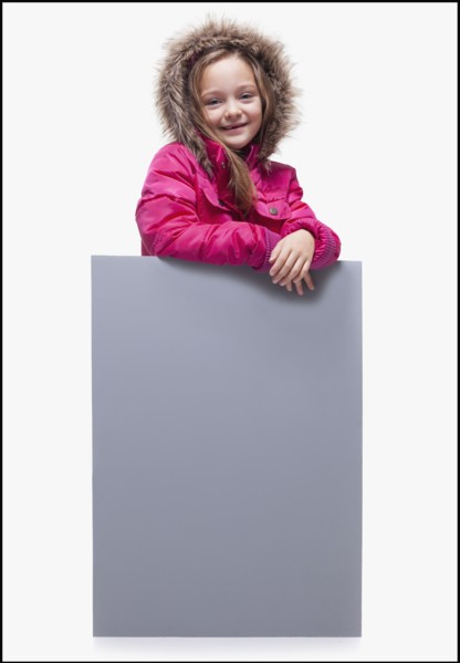 Young girl wearing winter coat. Photographer: Mike Kemp