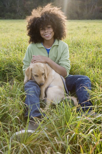 Child and dog. Photographer: Pauline St.Denis