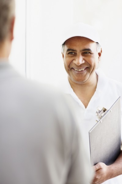 Handyman talking to customer. Photographer: momentimages