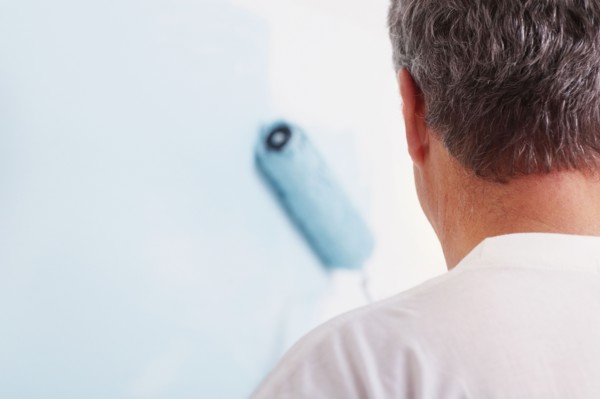Man painting wall. Photographer: momentimages