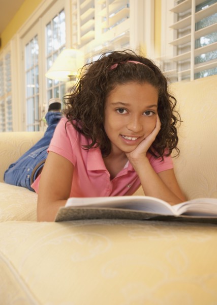 Young girl on couch. Photographer: mark edward atkinson