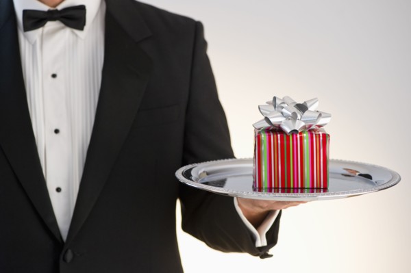 Butler holding gift.