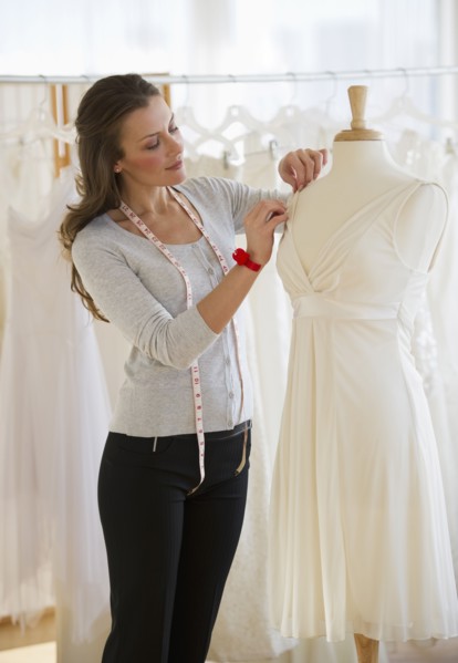 Seamstress in bridal shop.