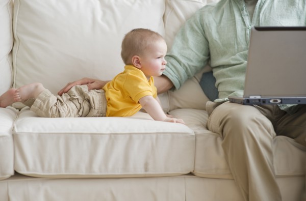 Father and son on couch.