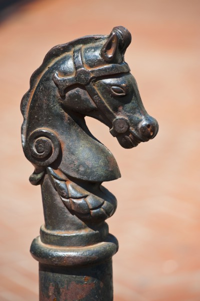 Iron statue of a horse's head.