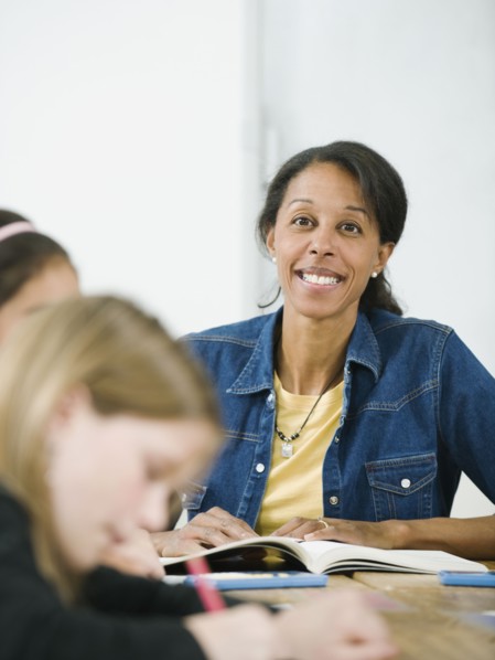 Elementary school teacher in classroom.