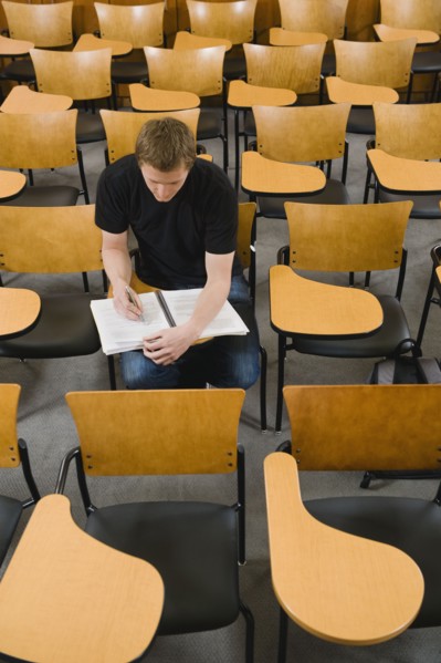Last student left in college lecture hall.