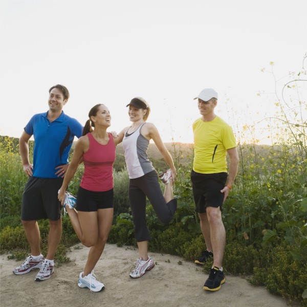 Trail runners stretching.