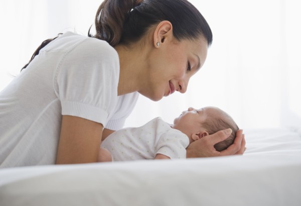 Mother sharing a tender moment with her baby.