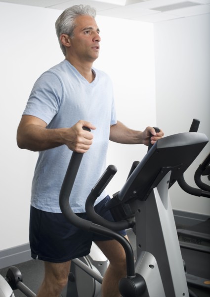 Man exercising on Stairmaster.