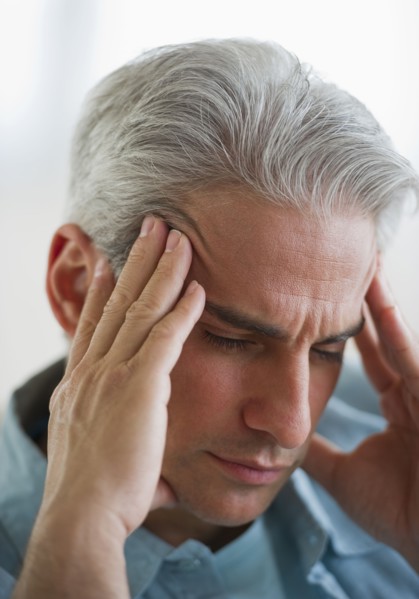 Man with a headache.