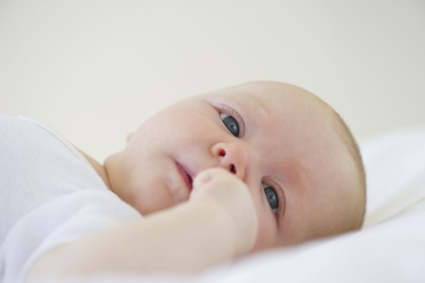 Infant lying on his back. Photo : Chris Grill