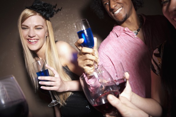 Group of people socializing at a party. Photo : Dan Bannister