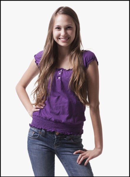 Portrait of a smiling teenage girl. Photo : Mike Kemp