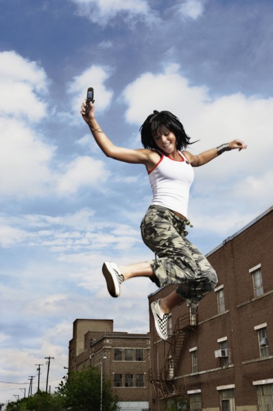 Teenage girl jumping in the air. Photo : Stewart Cohen
