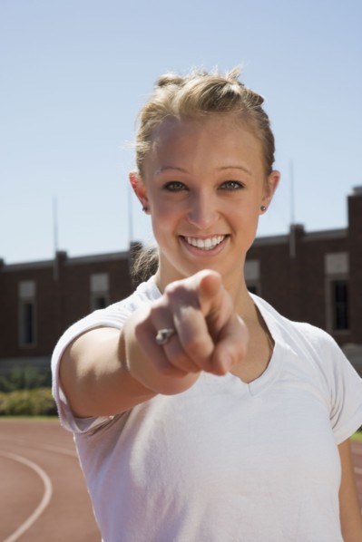 Teenage girl pointing her finger. Photo : Stewart Cohen