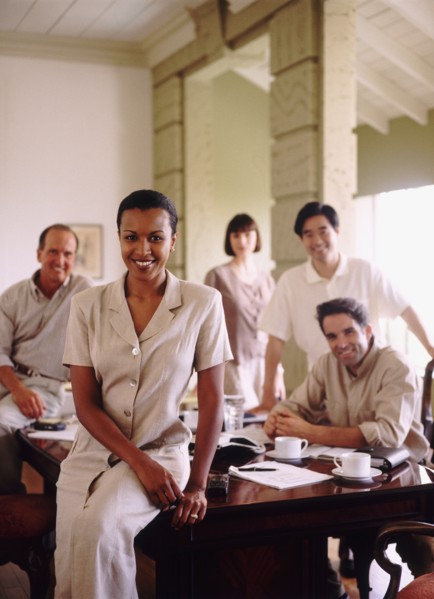 Business colleagues in conference room. Photo : Rob Lewine