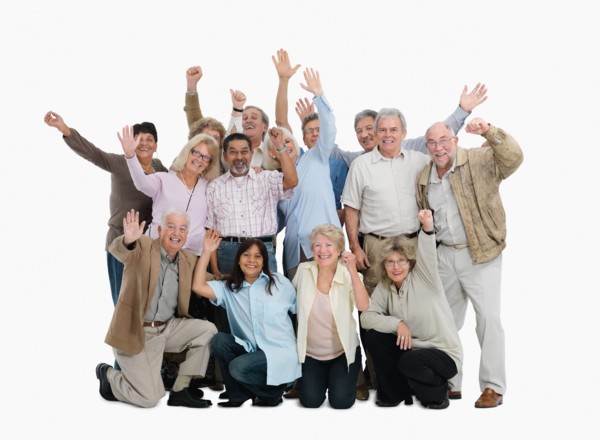 A group of people waving. Photo : momentimages