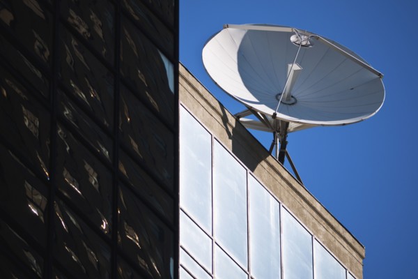 Satellite dish on top of building.