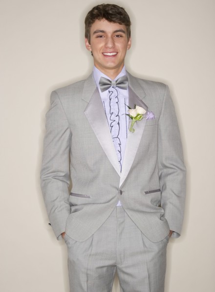 Man wearing grey tuxedo.