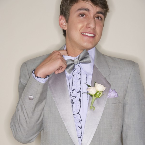 Man wearing grey tuxedo.