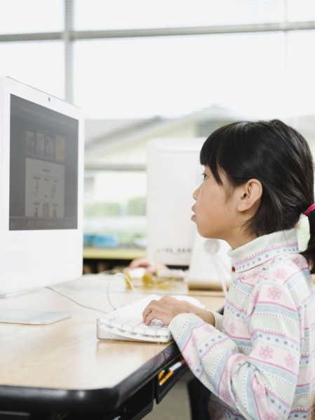 Student working on computer in classroom.