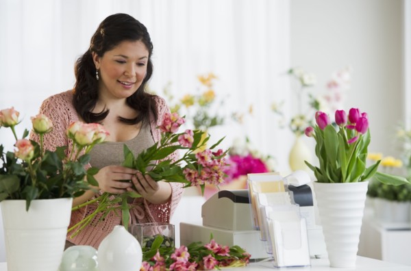 Florist making a floral arrangement.