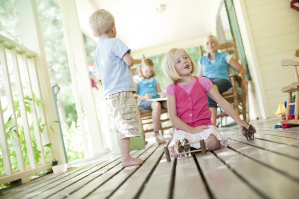 Children playing on porch. Photo. Tim Pannell