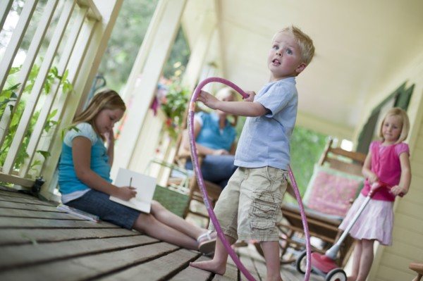 Children playing on porch. Photo. Tim Pannell